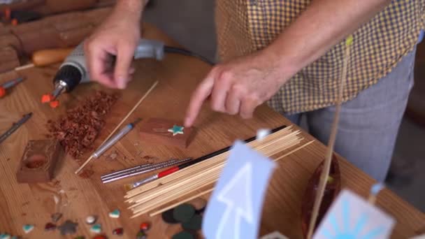 Talented joiner decorates his small wooden boat - Filmmaterial, Video