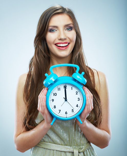 Young smiling woman hold watch. Beautiful smiling girl portrait - Photo, image