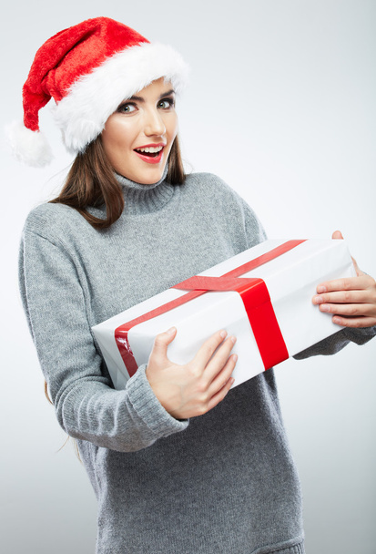 Christmas Santa hat isolated woman portrait hold christmas gift. - 写真・画像