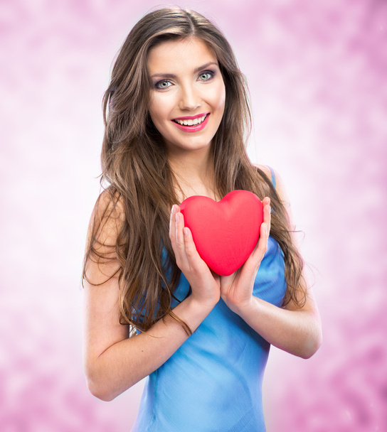 Heart, love symbol young happy woman hold - 写真・画像