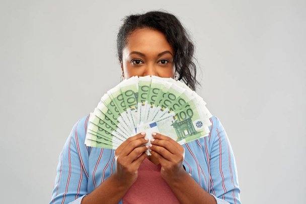 excited african american woman with euro money - Foto, imagen