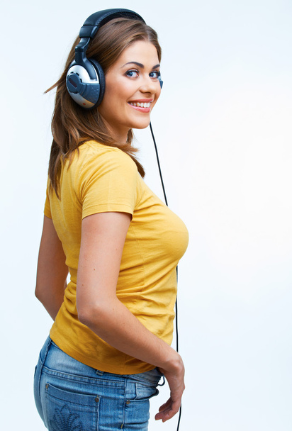 Young woman with headphones listening music .Music teenager gir - Zdjęcie, obraz