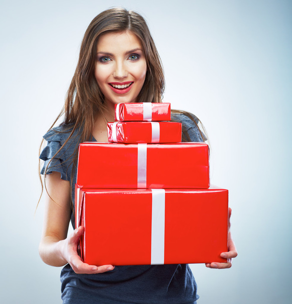 Portrait of young happy smiling woman hold red gift box. Isolat - Foto, Bild