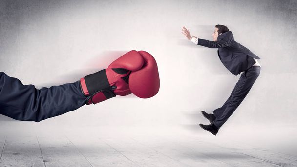 Huge Boxing Gloves punches businessman concept - Φωτογραφία, εικόνα