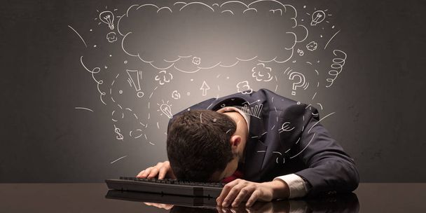 Businessman fell asleep at his workplace with ideas, sleep and tired concept - Photo, Image