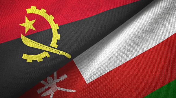 Angola i Oman dwie flagi tkanina tekstylna, tekstura tkaniny - Zdjęcie, obraz