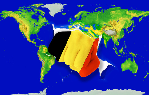 Fist in color national flag of belgium punching world map - Photo, Image
