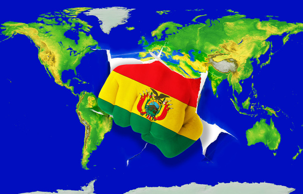 Fist in color national flag of bolivia punching world map - Photo, Image