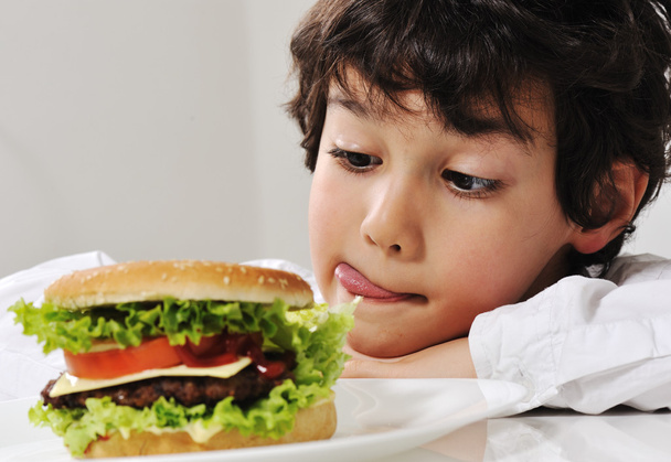 Boy on temptation with burger - Foto, Imagen