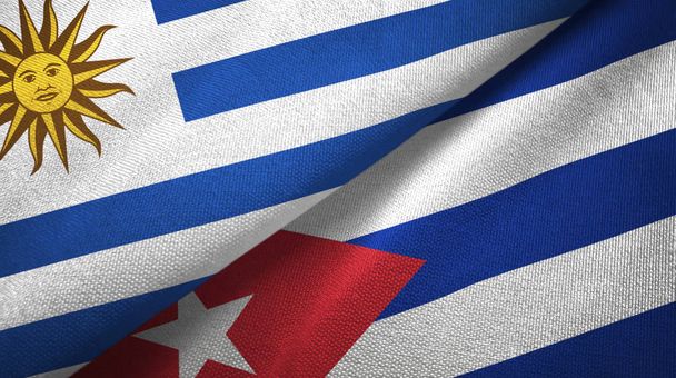 Uruguay és Kuba két zászló textil ruhával, szövet textúra - Fotó, kép