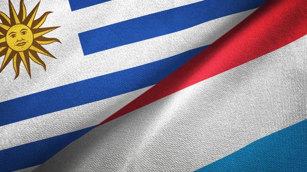 uruguay und luxembourg zwei flaggen textilstoff, textur - Foto, Bild