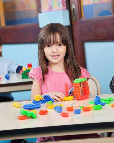 Girl Playing With Construction Blocks In Preschool - Photo, Image