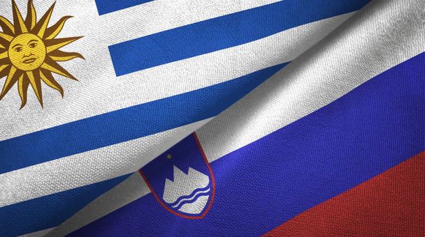 Uruguai e Eslovênia duas bandeiras de pano têxtil, textura de tecido
 - Foto, Imagem