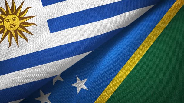 Uruguay et Îles Salomon deux drapeaux tissu textile, texture du tissu
 - Photo, image