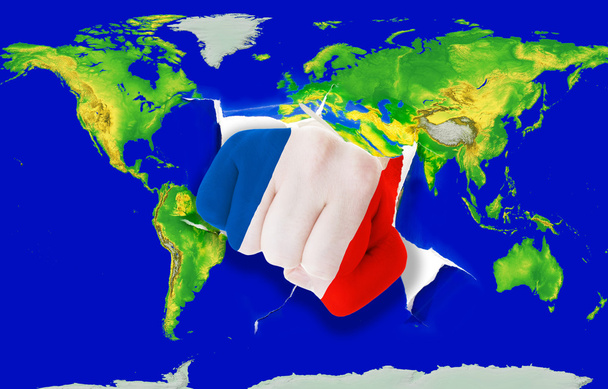 Fist in color national flag of france punching world map - Photo, Image