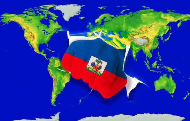 vuist in kleur nationale vlag van Haïti ponsen wereldkaart - Foto, afbeelding