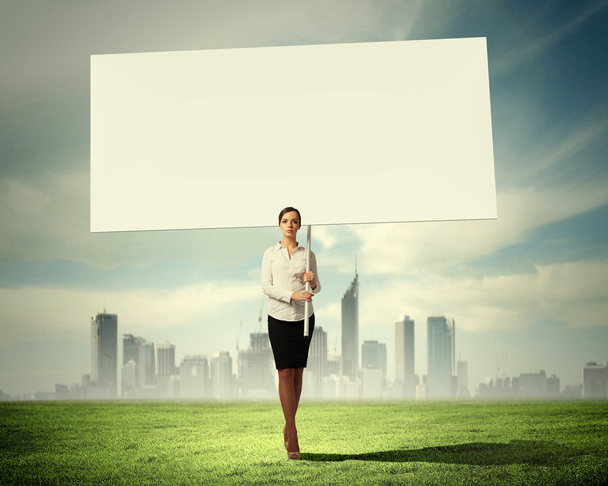Woman holding blank board - Foto, Imagen