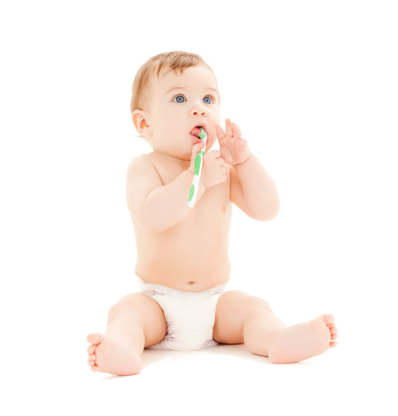 Curious baby brushing teeth - 写真・画像