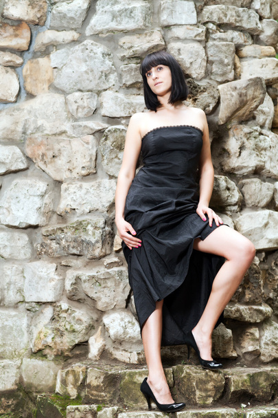 Woman in a black dress - Foto, afbeelding