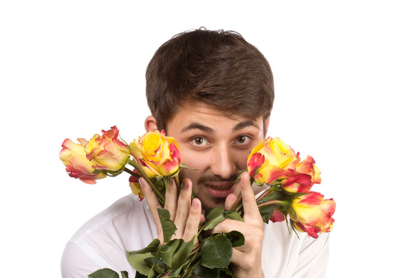 Man with bouquet of red roses. - Foto, imagen