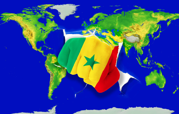 Fist in color national flag of senegal punching world map - Photo, Image