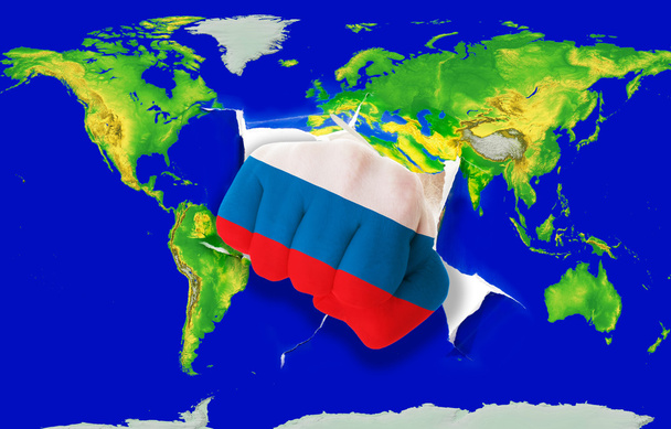 vuist in kleur nationale vlag van Rusland ponsen wereldkaart - Foto, afbeelding