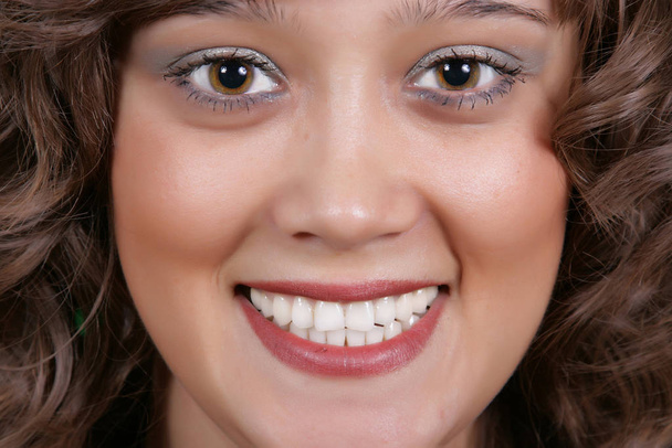 A smiling beautiful woman with a white teeth - Fotografie, Obrázek