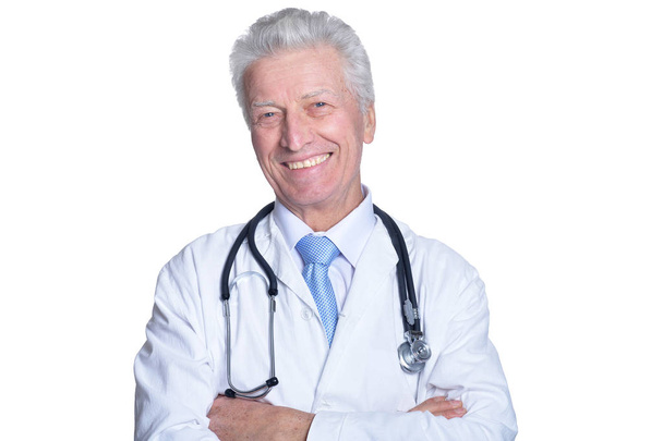 portrait of  senior male doctor with stethoscope on white background - Photo, Image