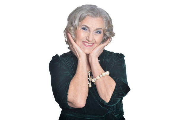 portrait of happy  senior woman posing  against white background - Фото, изображение