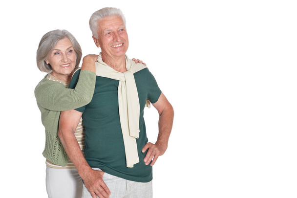 Portrait of happy senior couple embracing isolated on white background - Fotó, kép