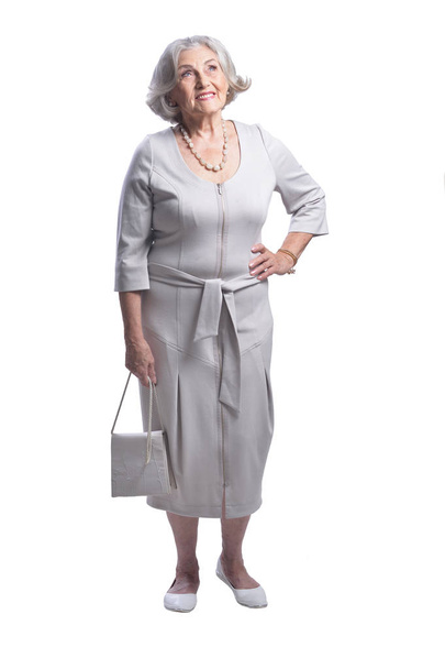 portrait of beautiful senior woman posing  against white background - Zdjęcie, obraz