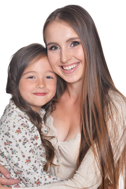 Mother and little child girl on a white background - Valokuva, kuva