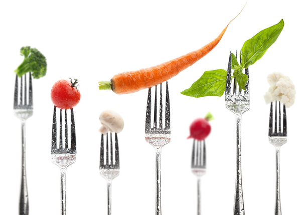 Vegetables on a fork - Фото, изображение