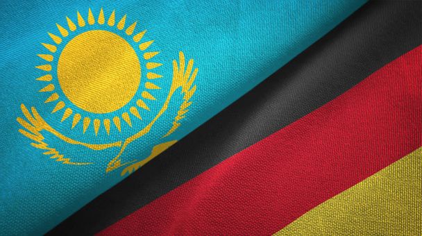 Kazachstan en Duitsland twee vlaggen textiel doek, weefsel textuur - Foto, afbeelding