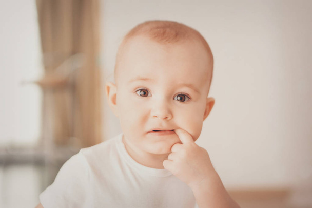 portrait of a newborn baby with a pen at the face - Foto, Imagen