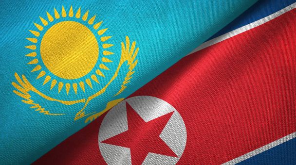Kazachstán a Severní Korea dvě vlajky textilní tkaniny, textura textilií - Fotografie, Obrázek