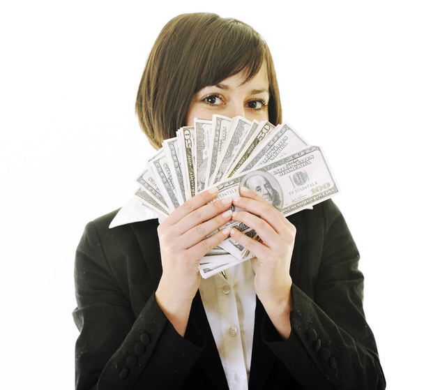 happy young business woman isolated on white playing with dollars money and representing success in finance - 写真・画像