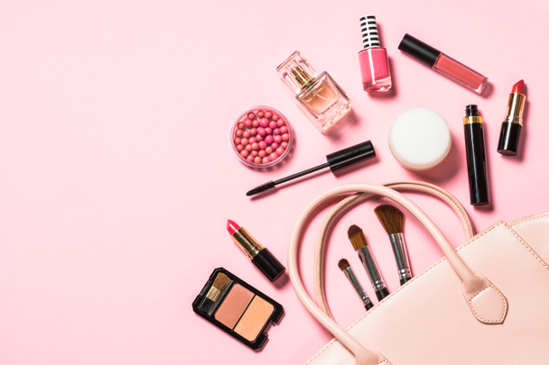 Woman flat lay makup background with cosmetics on pink. - Photo, Image