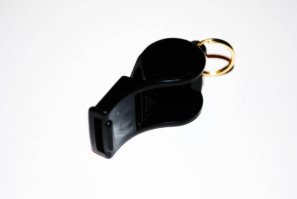 A  black trill whistle. - Photo, Image
