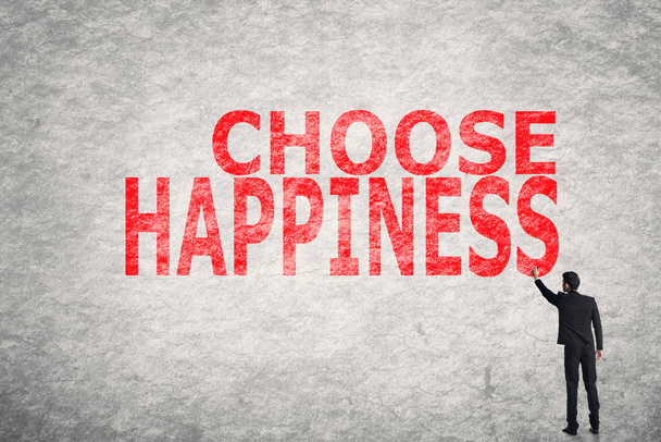 Ασιατικές επιχειρηματίας γράψτε κείμενο στον τοίχο, επιλέξτε την ευτυχία - Φωτογραφία, εικόνα