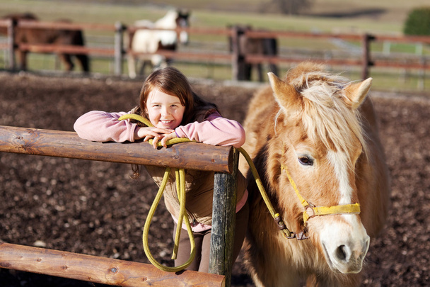 Portrait of a smiling girl with her horse - Fotografie, Obrázek