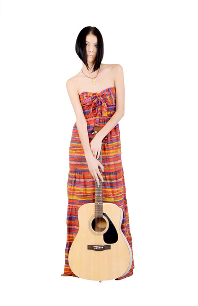 Girl standing near the guitar - Foto, imagen