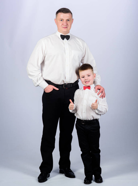 toffs father and son in formal suit. small boy with dad businessman. family day. male fashion. parenting. fathers day. happy child with father. business meeting party. tuxedo style. toffs concept - Фото, изображение
