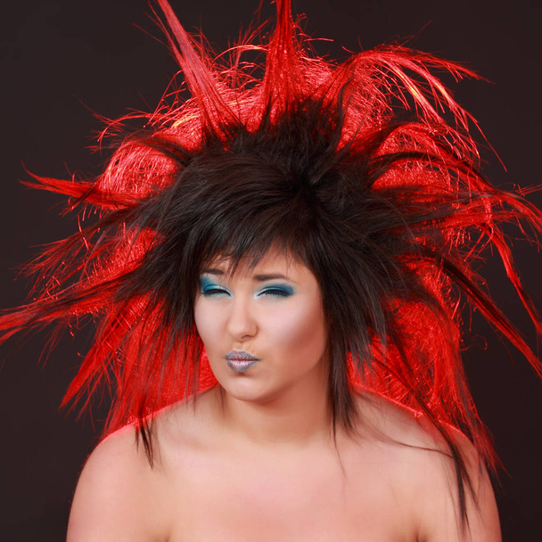expressive girl with red light in her hair - Valokuva, kuva