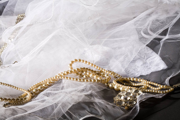 macro picture of veil with  wedding adornment - Fotó, kép