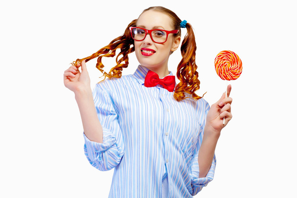 Young woman holding candy - Fotografie, Obrázek