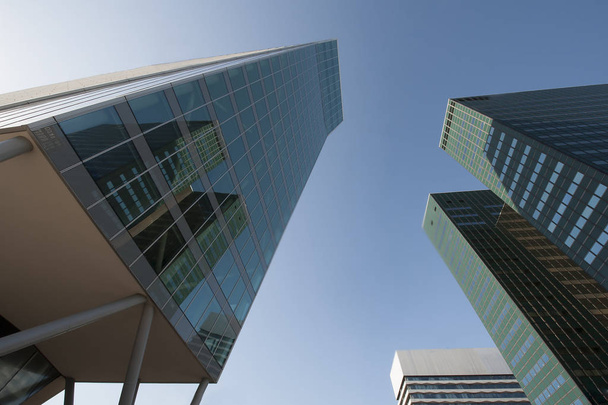 Three green highrises with mirror glass and reflection of office buidlings - Φωτογραφία, εικόνα