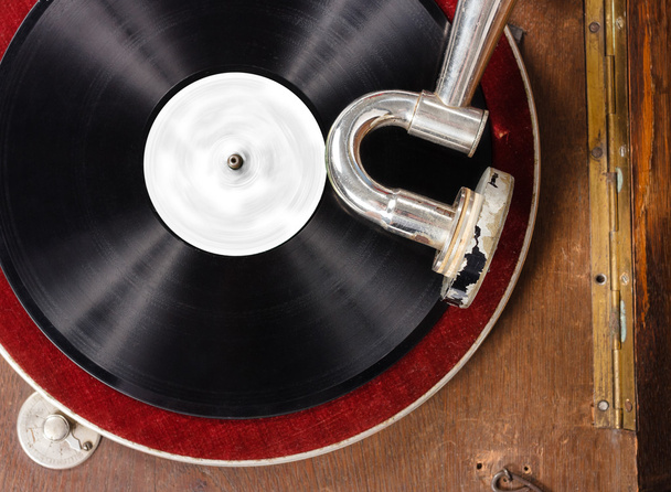 Retro gramophone with vinyl spinning - Photo, Image