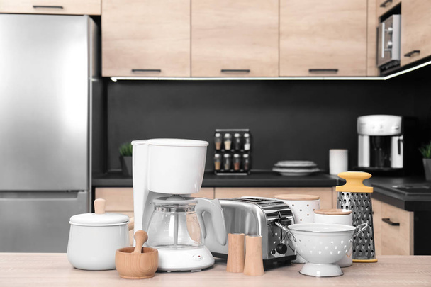 Set with modern domestic appliances in kitchen - Zdjęcie, obraz