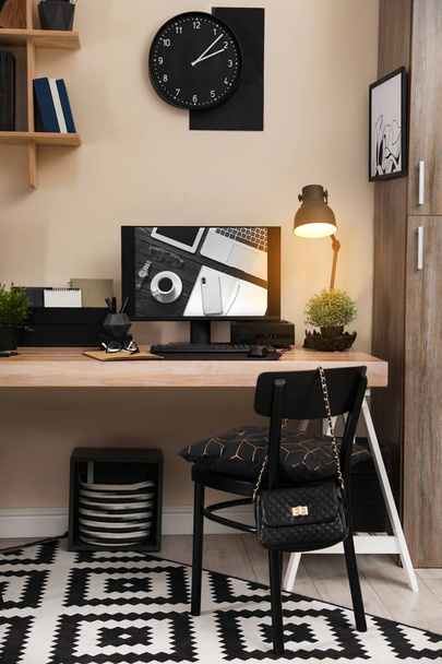 Stylish workplace interior with computer on table - Фото, зображення